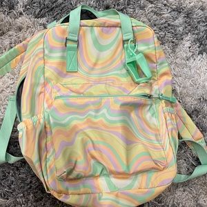 Back-pack with multi color swirl design